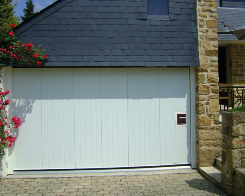 Side garage door with wicket door